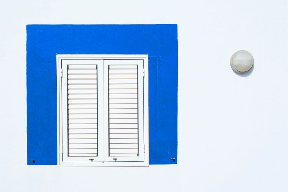Elegant white plantation shutters in a brightly lit room