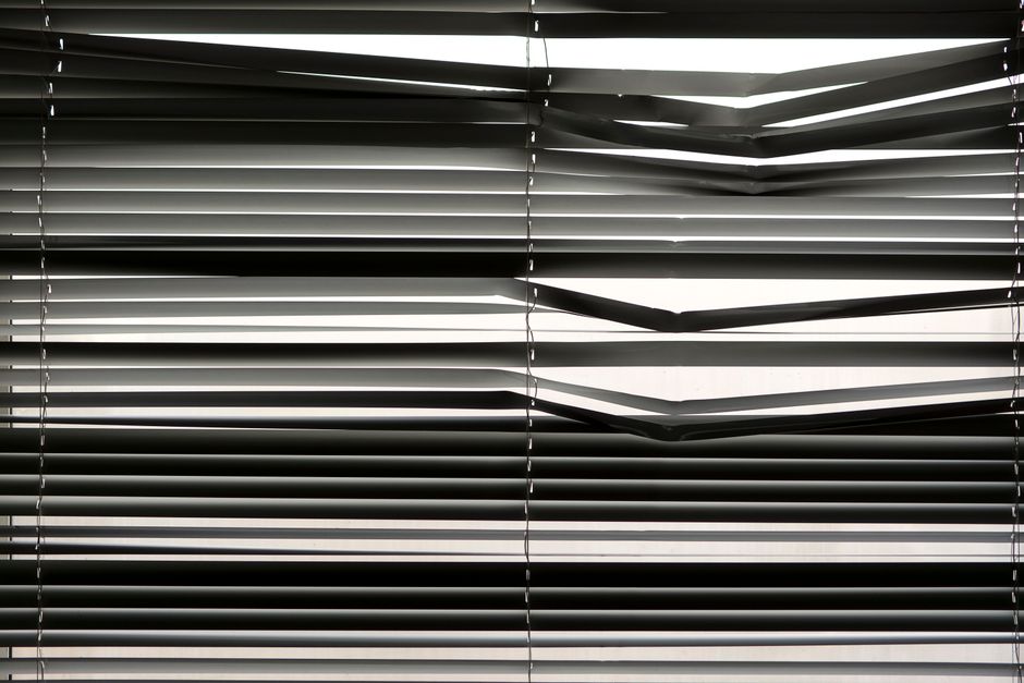 Modern window roller shades drawn down in a living space