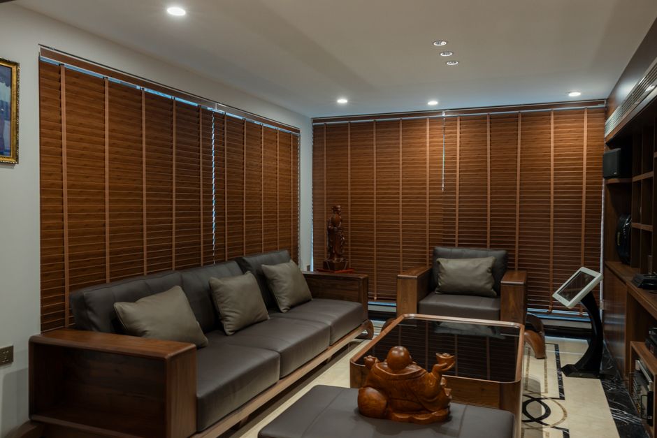 Modern living room with beautiful custom blinds allowing natural light